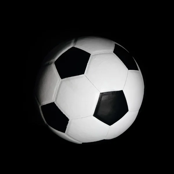 Fotbalový míč na černém pozadí — Stock fotografie