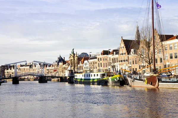 View at Dutch canal with old bridge, boats and churches at Haarlem, The Net — Stock Photo, Image