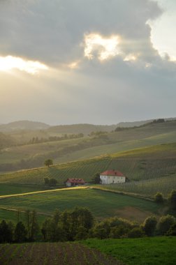 Sunset over the rolling hills clipart