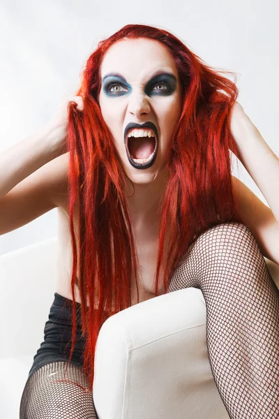 Expressive gothic woman with artistic makeup — Stock Photo, Image