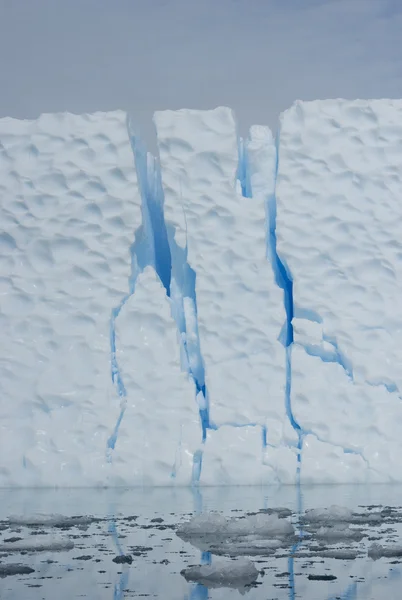 stock image Iceberg with large cracks.