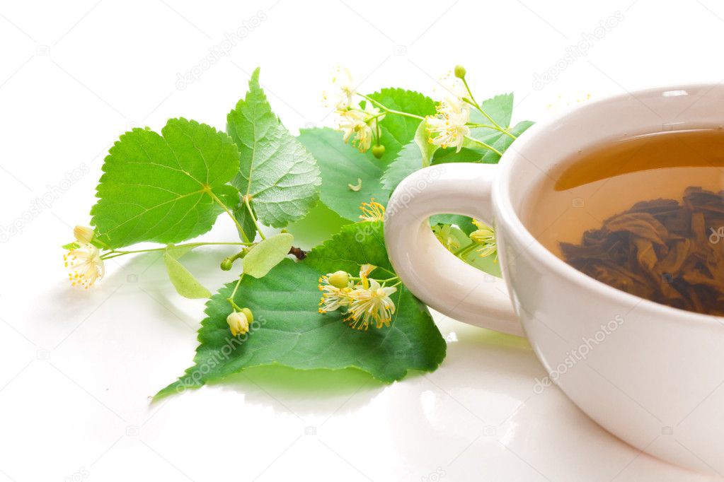 Cup with green tea, with leaflets and linden flowers