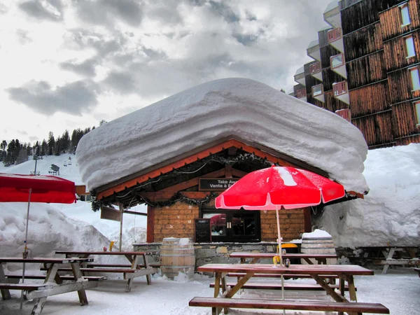 A snow covered cabin in La Plagne