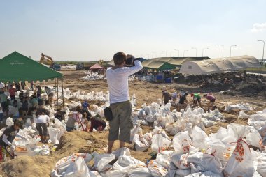 Bangkok THAILAND - OCT 31: Thai volunteers made sand bags clipart