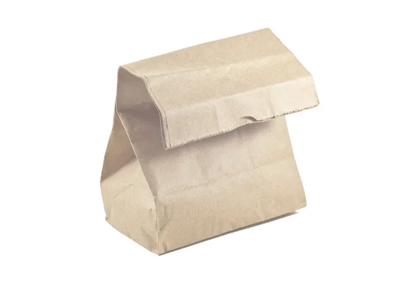 Бумажный пакет на белом фоне, изолированный — стоковое фото