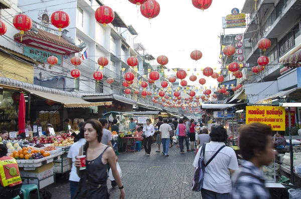 stock image BANGKOK - December 30: Red lanterns and decorations span Yaowara