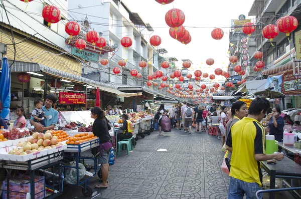 stock image BANGKOK - December 30: Red lanterns and decorations span Yaowara