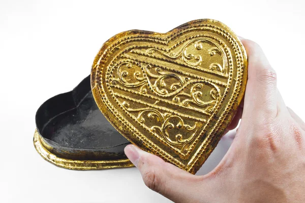 Hands holding golden heart — Stock Photo, Image