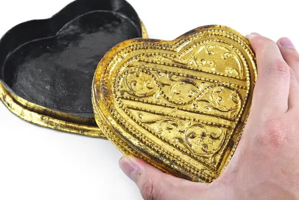 stock image Hands holding golden heart