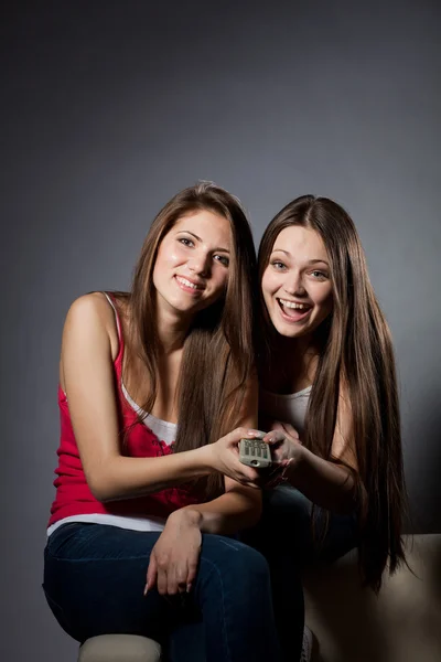 Two girls are watching TV — Stock Photo, Image