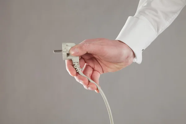 Hand and plug — Stock Photo, Image