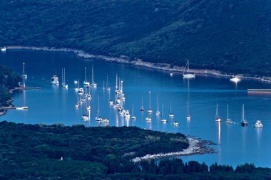 Island of Ilovik safe nautical harbor at dusk clipart