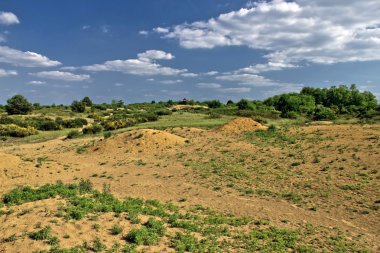 Colorful european desert landscape under blue sky clipart