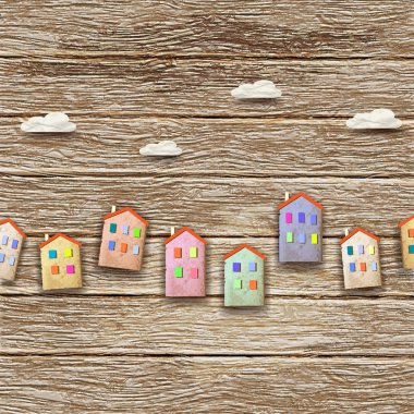 Colorful homes on wooden background clipart