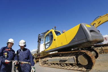 Construction engineers and bulldozer clipart