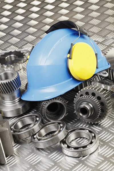 Hardhat and machine-parts concept — Stock Photo, Image