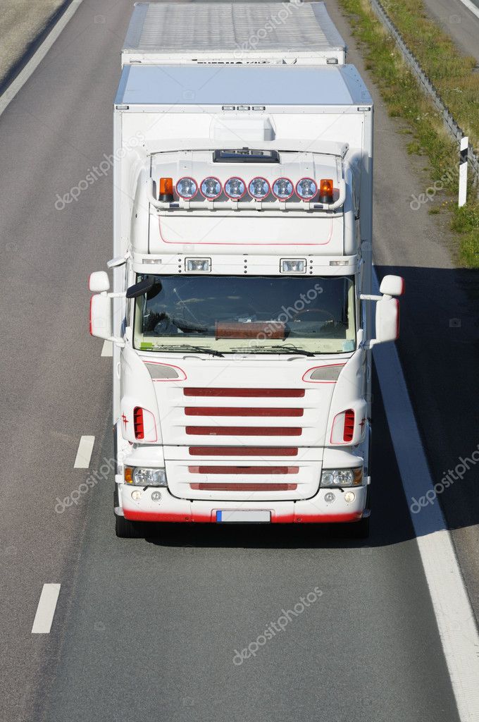 Truck driving head on against camera