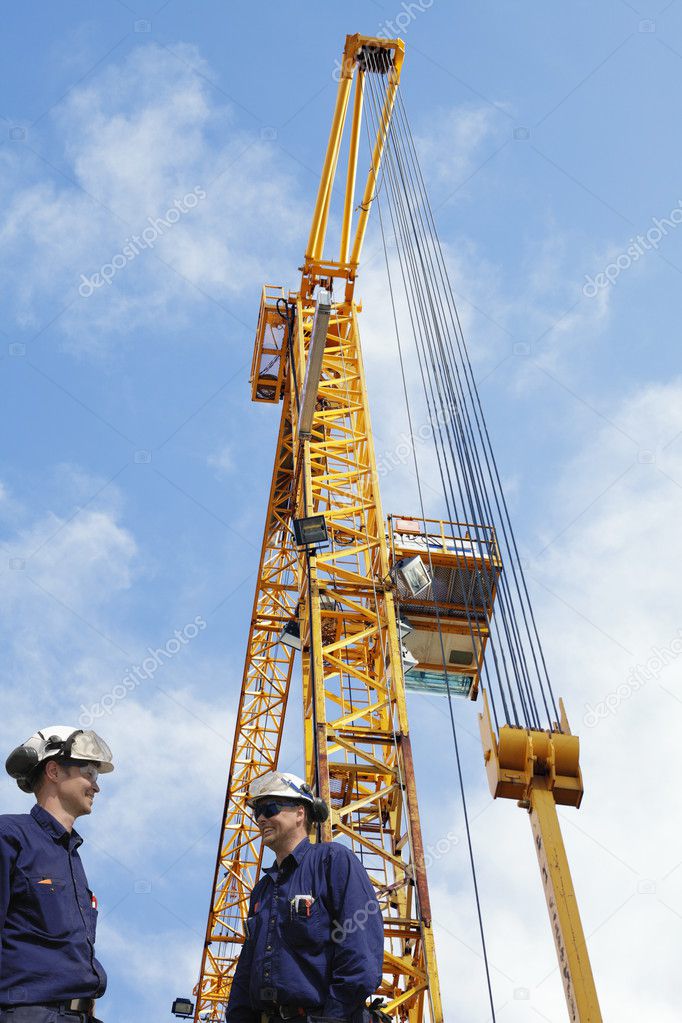 Construction cranes and engineers