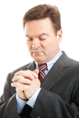 Stock Photo of Businessman Praying clipart