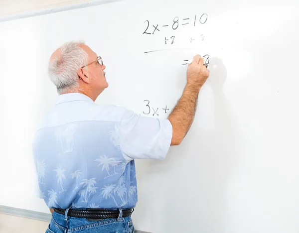 Stockfoto van leraar of volwassen student op blackboard — Stockfoto