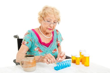 Woman In Wheelchair Counts Pills clipart