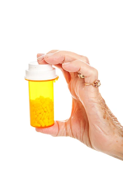 Vedoucí ruky s pilulku láhev — Stock fotografie