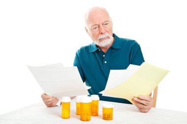 Depressed Senior Man - Medical Bills clipart