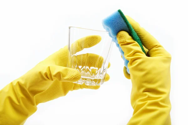 Ands in rubber gloves, sponge wash the glass on a white backgrou — Stock Photo, Image
