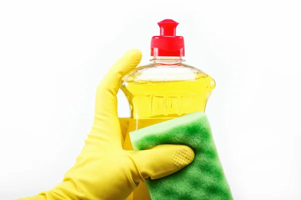 Elinde lastik eldiven deterjan ve Sünger üzerine bir şişe — Stok fotoğraf