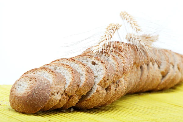 Fresh bread on a bamboo napkin. — Stock Photo, Image