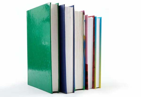 Una pila de libros sobre un fondo blanco . —  Fotos de Stock