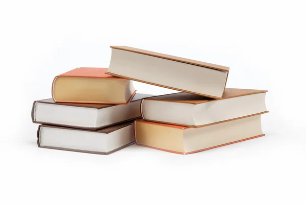 Una pila de libros sobre un fondo blanco . — Foto de Stock