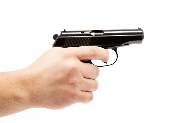 Zbraň v ruce na bílém pozadí. — Stock fotografie