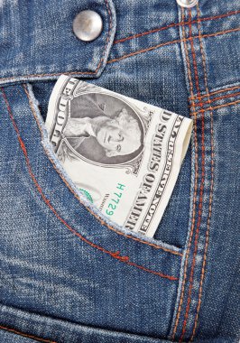 Dollar bill in his pocket jeans. clipart