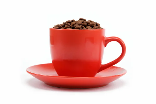 Taza con café frijoles en platillo — Foto de Stock