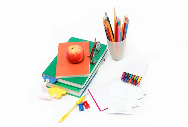 stock image School supplies: books, notebook, pens, pencils, glasses, an app