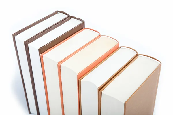 Una pila di libri su sfondo bianco. — Foto Stock