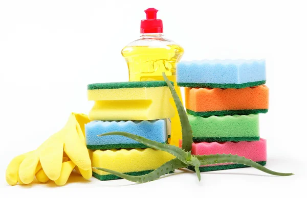 Detergent bottle, rubber gloves and cleaning sponge on a white b — Stock Photo, Image