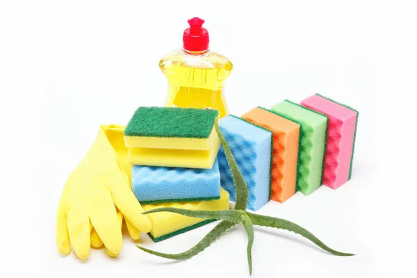 Detergent bottle, rubber gloves and cleaning sponge on a white b — Stock Photo, Image