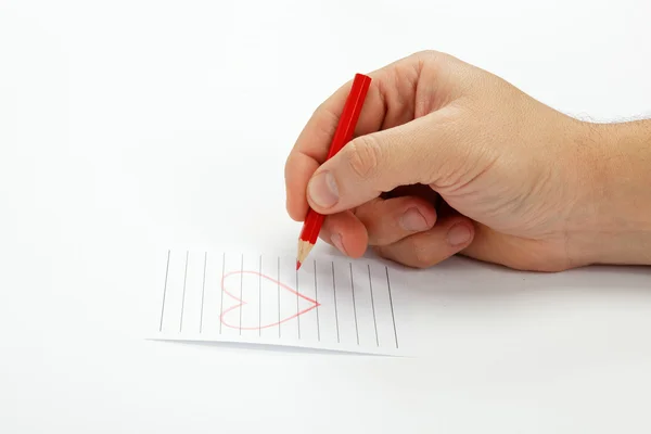Hand met potlood tekent het hart — Stockfoto