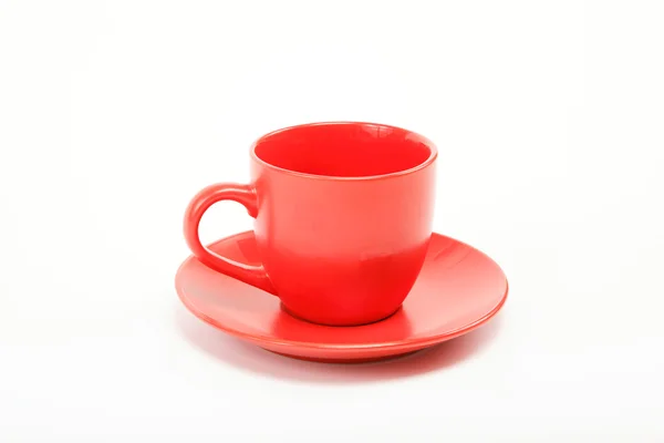 stock image Cup and saucer are on white