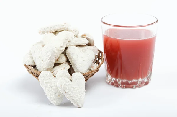 Light lunches. Cookies and a glass of juice on a white backgroun — Stock Photo, Image