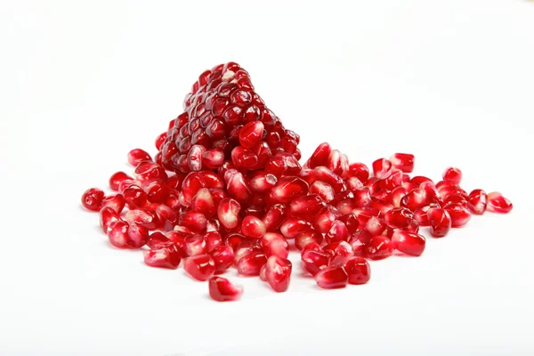 Pomegranate seeds on a white background Royalty Free Stock Images