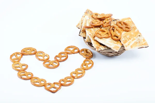 Crispy pretzels stacked in the form of the heart. — Stock Photo, Image