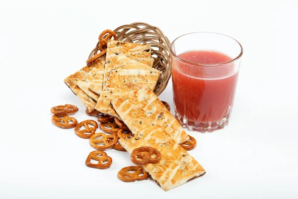 Light lunches. Crunchy biscuits and juice. — Stock Photo, Image