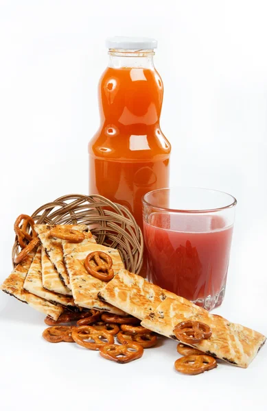 Light lunches. Crunchy biscuits and juice on a white background. — Stock Photo, Image