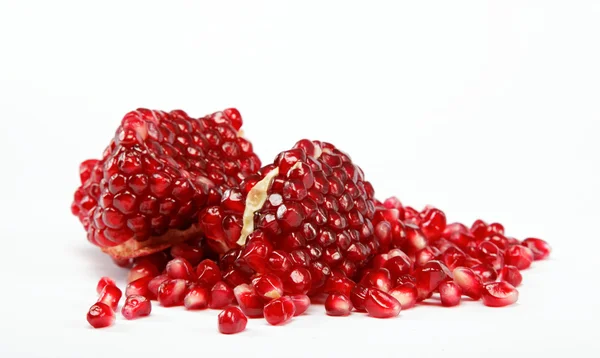 Pomegranate seeds on a white background — Stock Photo, Image
