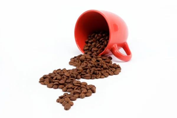 Flow beans from an overturned cup on a white background. — Stock Photo, Image