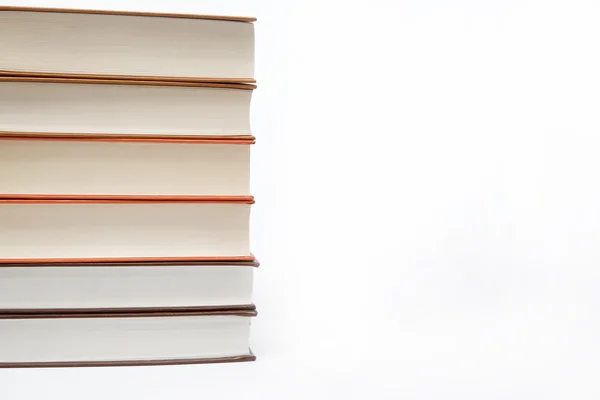 En hög böcker på en vit bakgrund. — Stockfoto