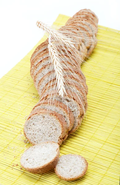 Fresh bread on a bamboo napkin. — Stock Photo, Image